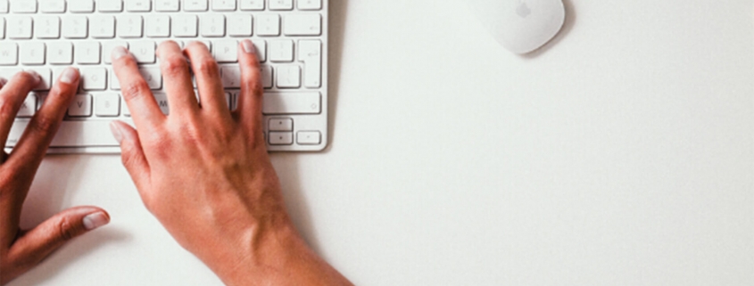 Person using keyboard and mouse